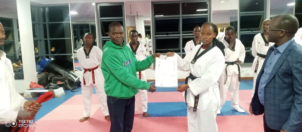 Athletes and coaches at a taekwondo award presentation